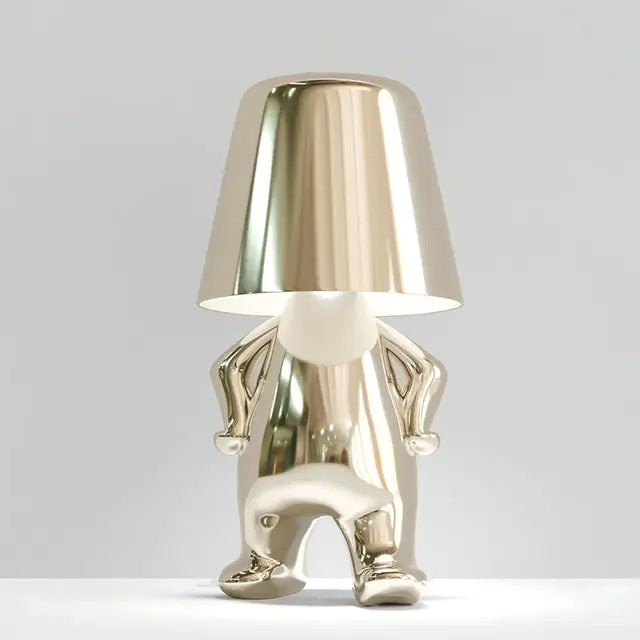 Silver Table lamp featuring an adorable little man design with LED light.