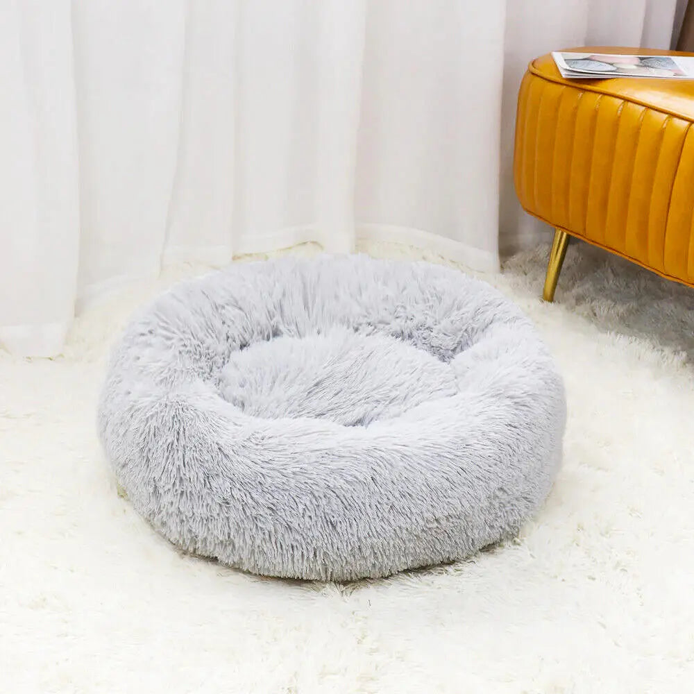 Pet nest bed made of plush material, providing warmth and comfort to your pet.