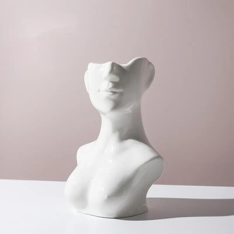 Artistic human body ceramic vase, a conversation piece for any room.