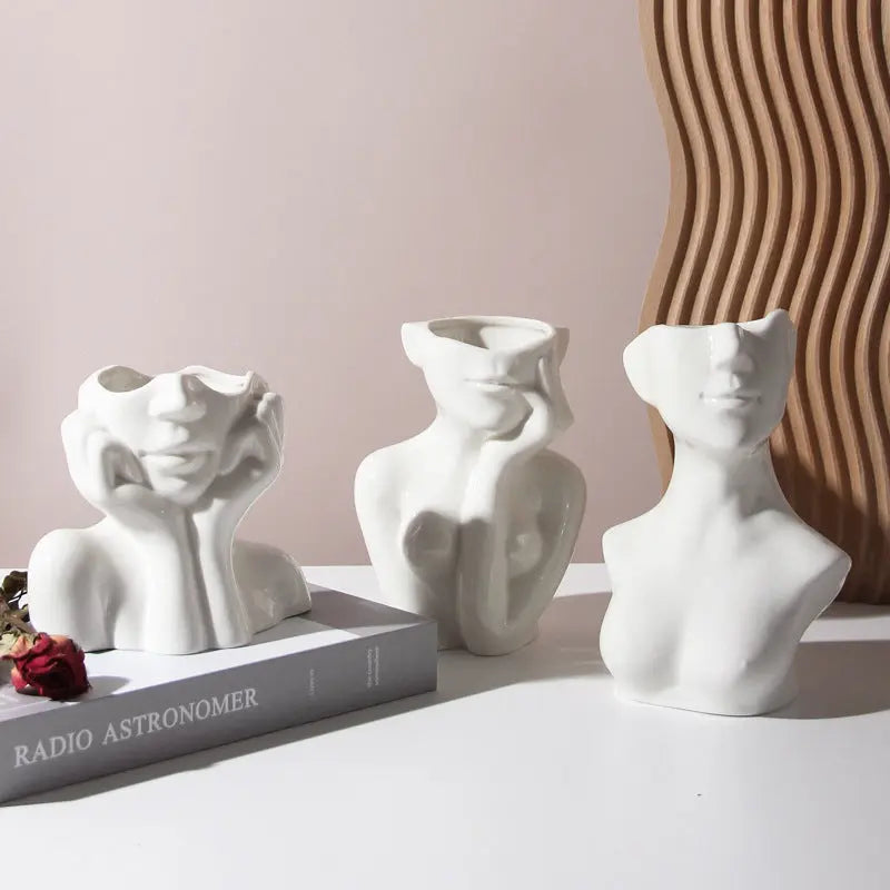 Ceramic vase shaped like a human body, adding a creative touch to your decor.