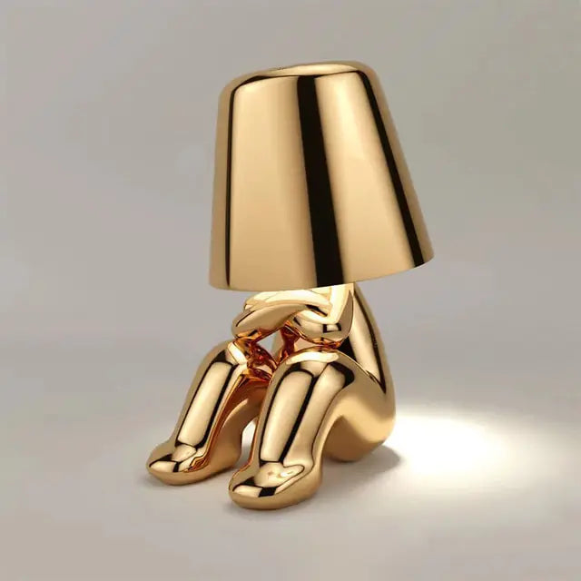 Gold Table lamp featuring a cute little man design, perfect for a playful touch in your home.