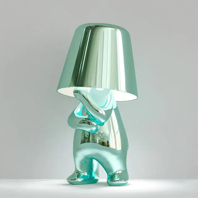 LED table lamp designed as a miniature man figure, perfect for bedside tables or desks.