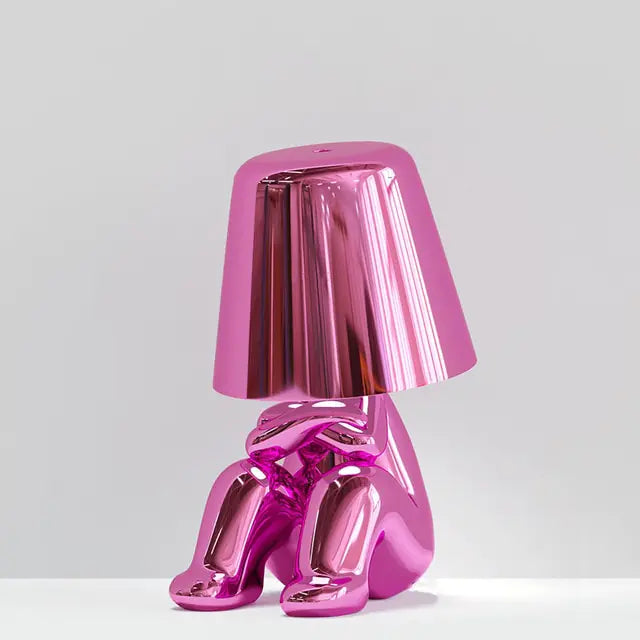 Pink miniature man-shaped LED table lamp, offering a unique and fun lighting solution.