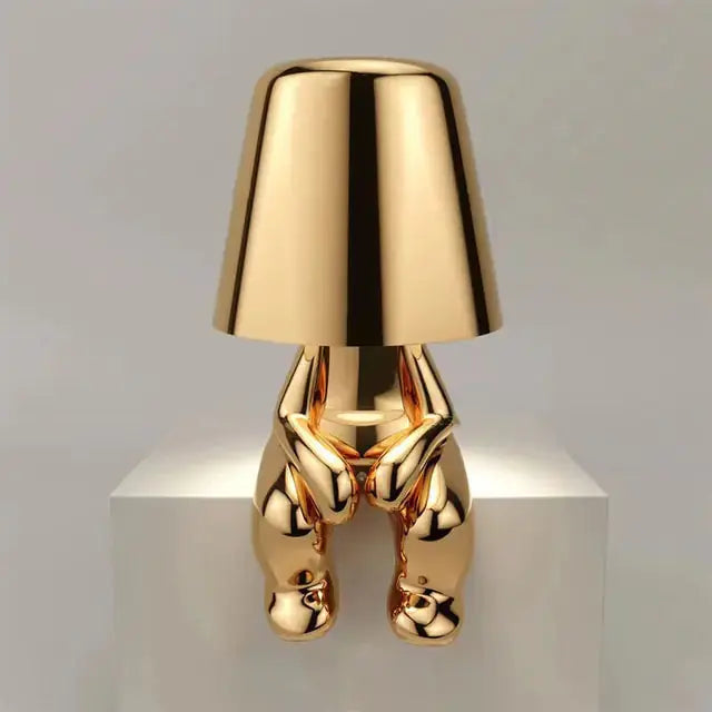 Gold little man LED table lamp, a delightful and quirky addition to your home.