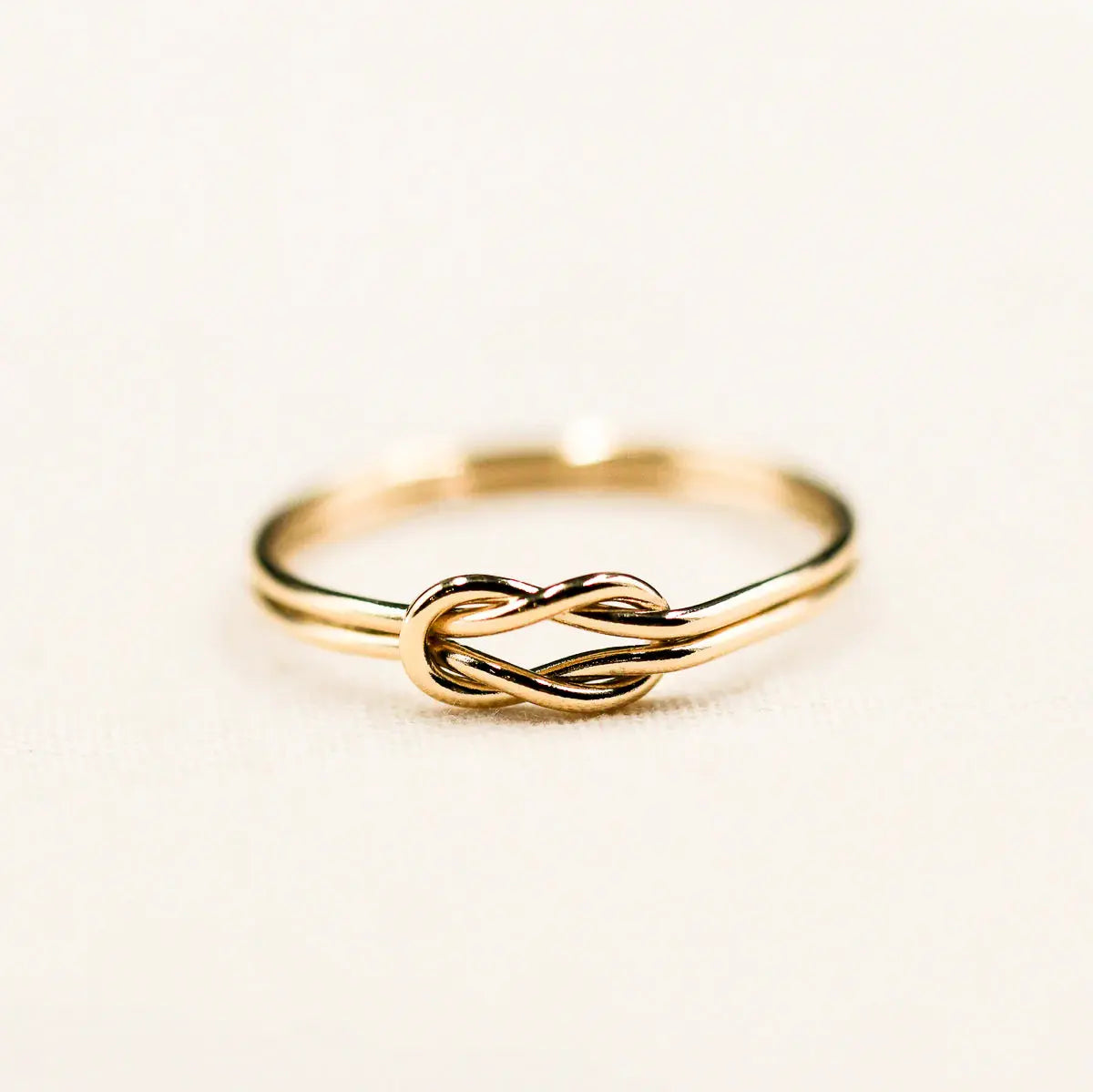 Gold knot infinity ring, a timeless piece representing endless possibilities.