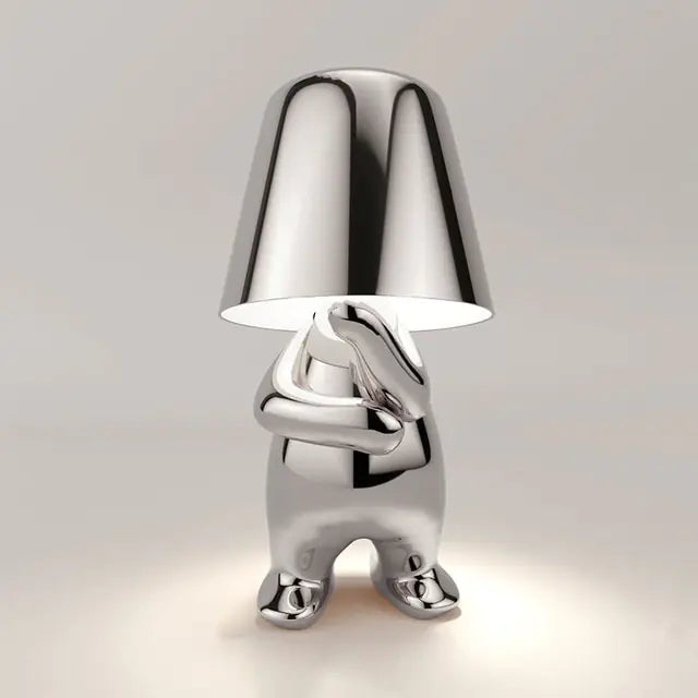 Silver Little man LED lamp, a charming and functional piece for your desk or bedside table.