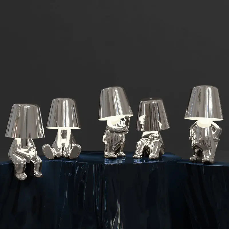 Table lamp featuring a small man design with LED lighting.